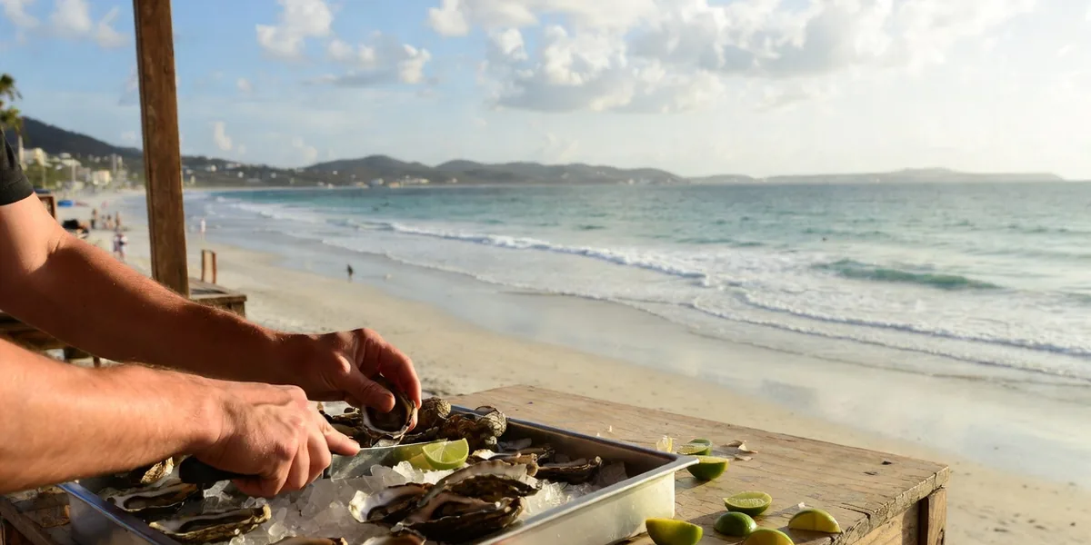 Fresh oysters being shucked at a beachfront table in Bucerías