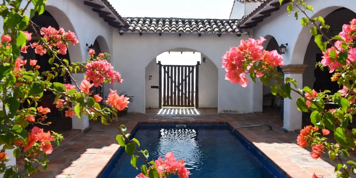 Bougainvillea courtyard pool at a small Bucerías inn steps from the beach