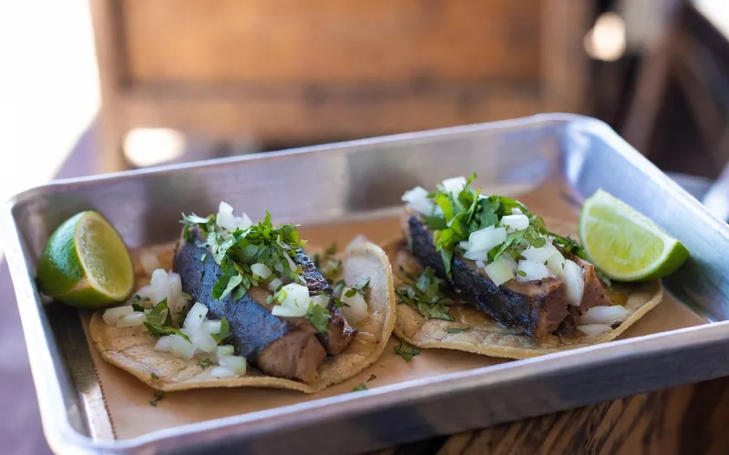 Smoked marlin tacos with onion and cilantro on corn tortillas, a Baja California Sur specialty