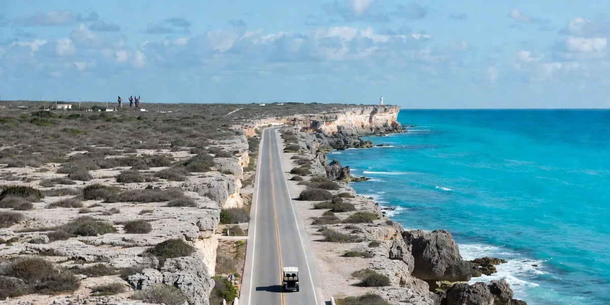 Golf cart on a coastal road along Isla Mujeres