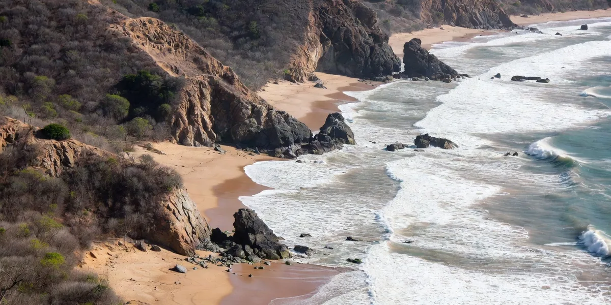 Aerial chain of wild coves and surf beaches along the Oaxaca coast