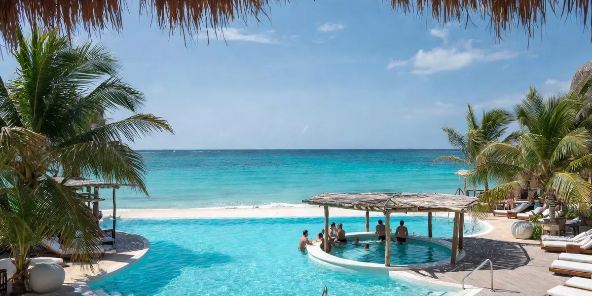 Swim-up bar and infinity pool at a beachfront all-inclusive resort in Playa del Carmen