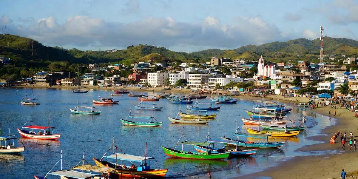 Panga fleet moored in Puerto Escondido's main bay with the town rising behind