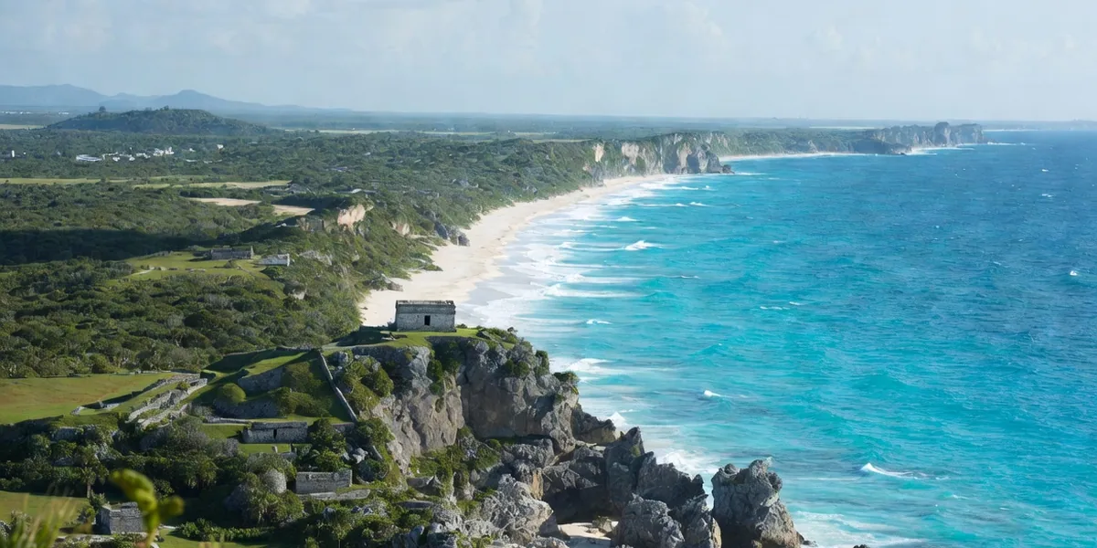High coastal view of the Tulum ruins headland on the Riviera Maya, Caribbean curving to the horizon